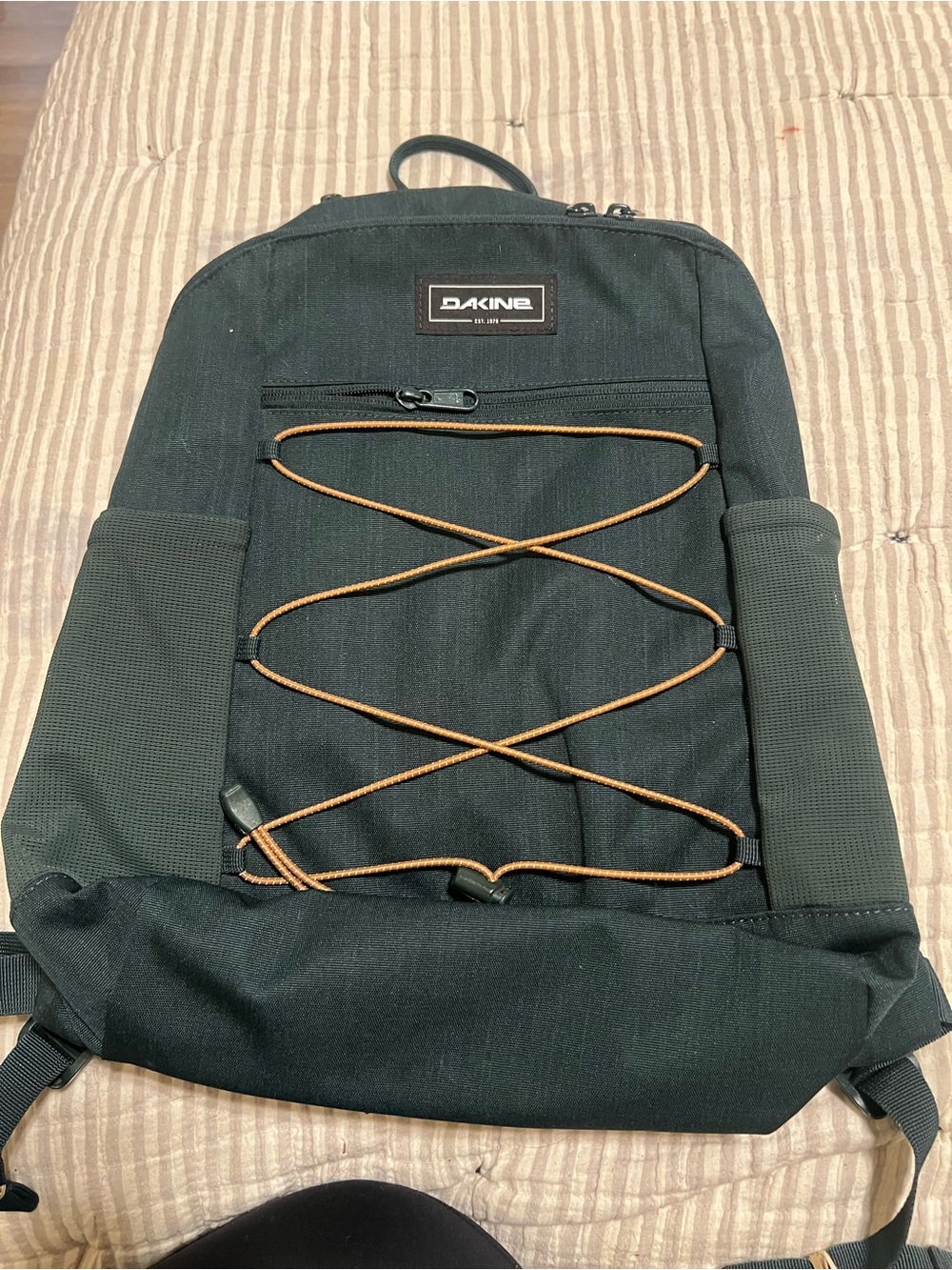 Dakine Black Backpack with Brown Bungee Cord Detail